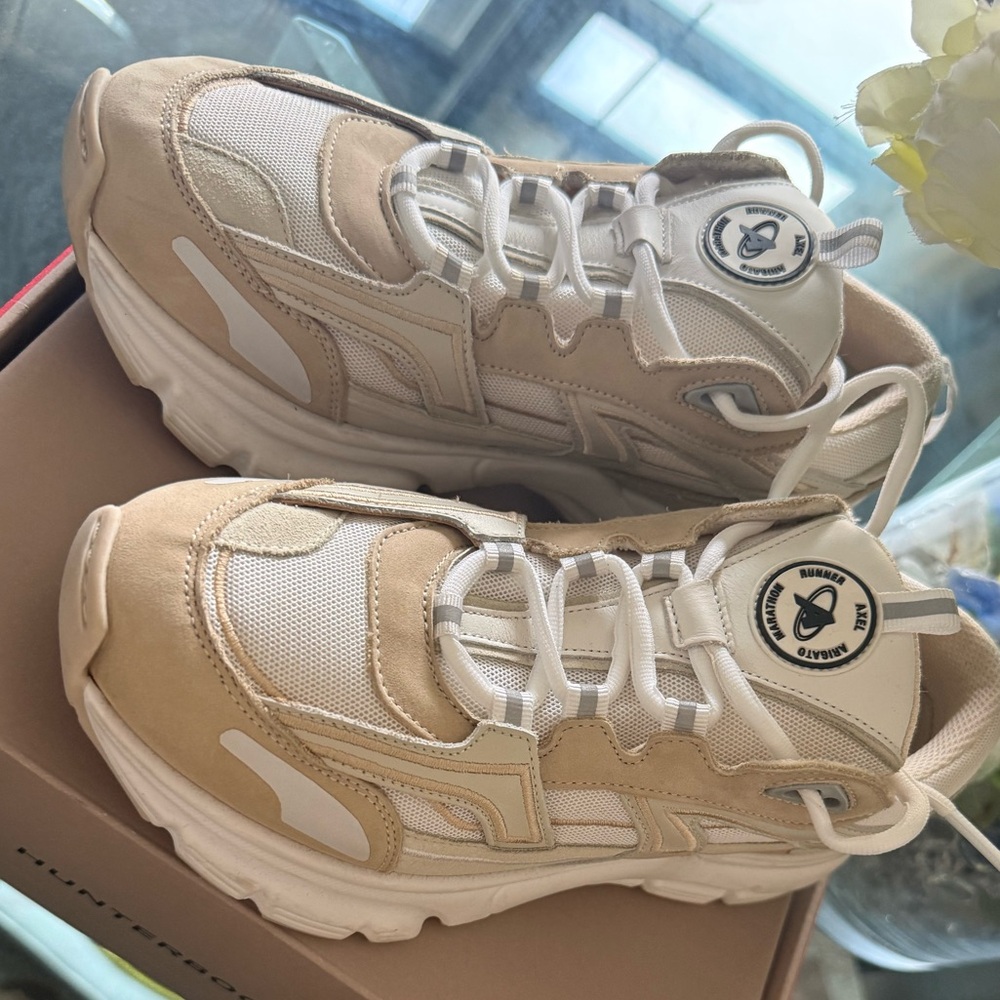 Axel Arigato Cream and White Sneakers